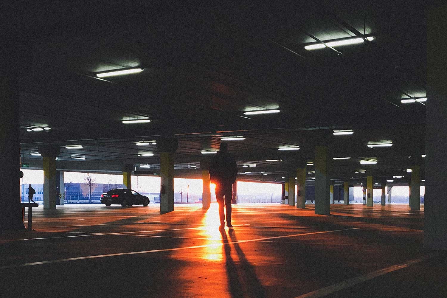 Moody parking garage with dramatic backlight
